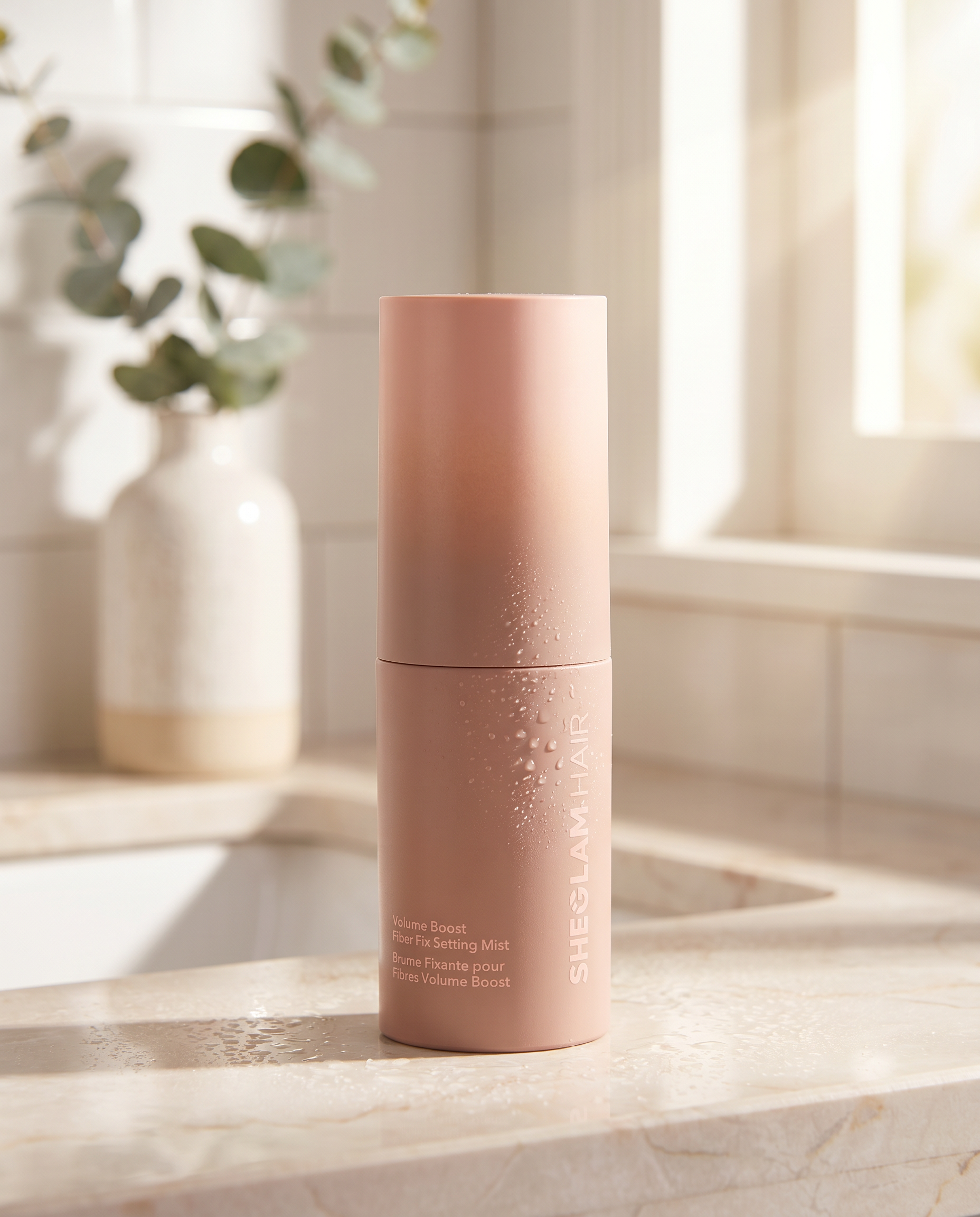 Hair setting mist bottle on sunlit bathroom counter