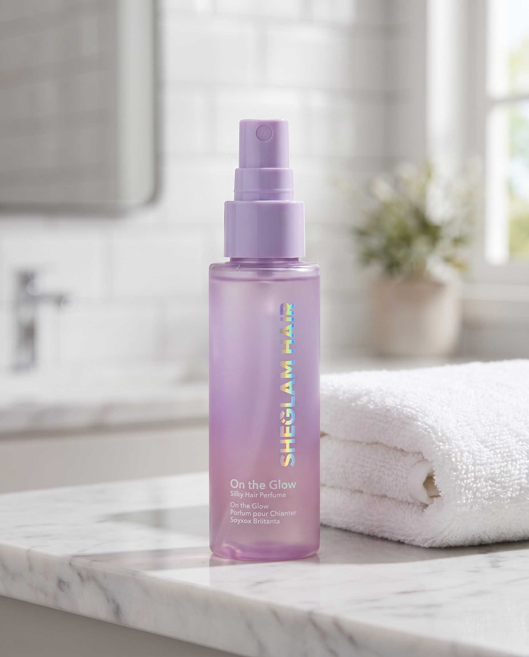 Hair perfume detangler mist bottle on bathroom counter