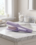 Curling iron on marble bathroom counter