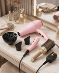 Pink ionic hair dryer kit flat lay with attachments